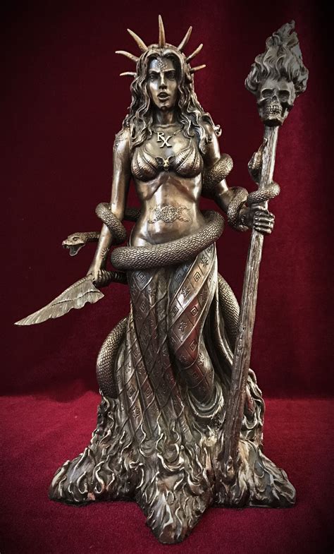 Rotating witch statuette
